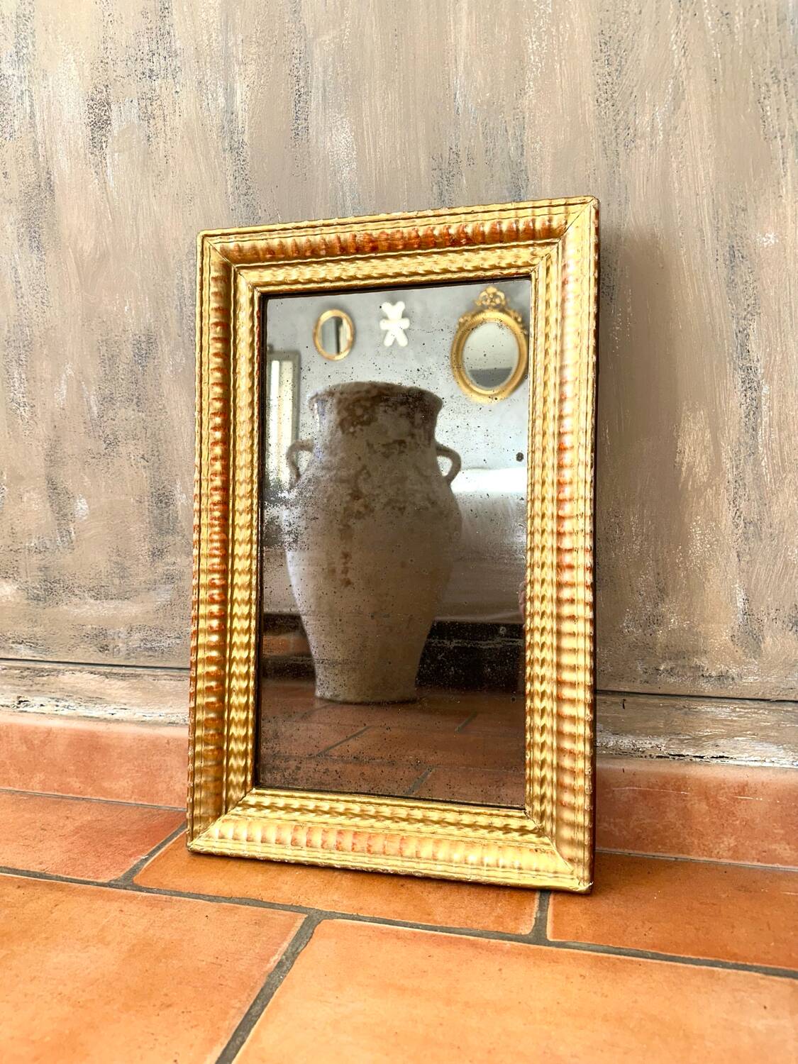Antique gilded mirror from the Directoire period, 19th century.