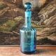 Large blown crystal bottle, twisted, turquoise blue, early 20th century.