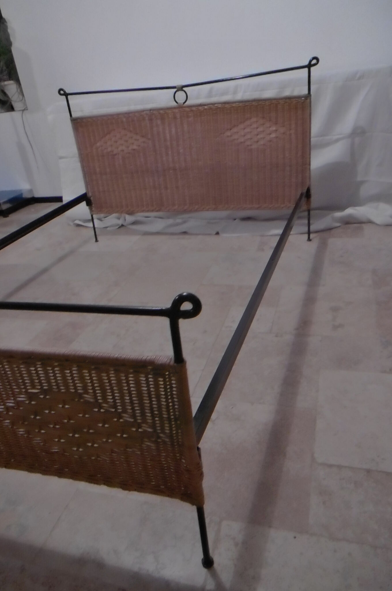 Black metal and rattan bed frame