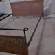 Black metal and rattan bed frame