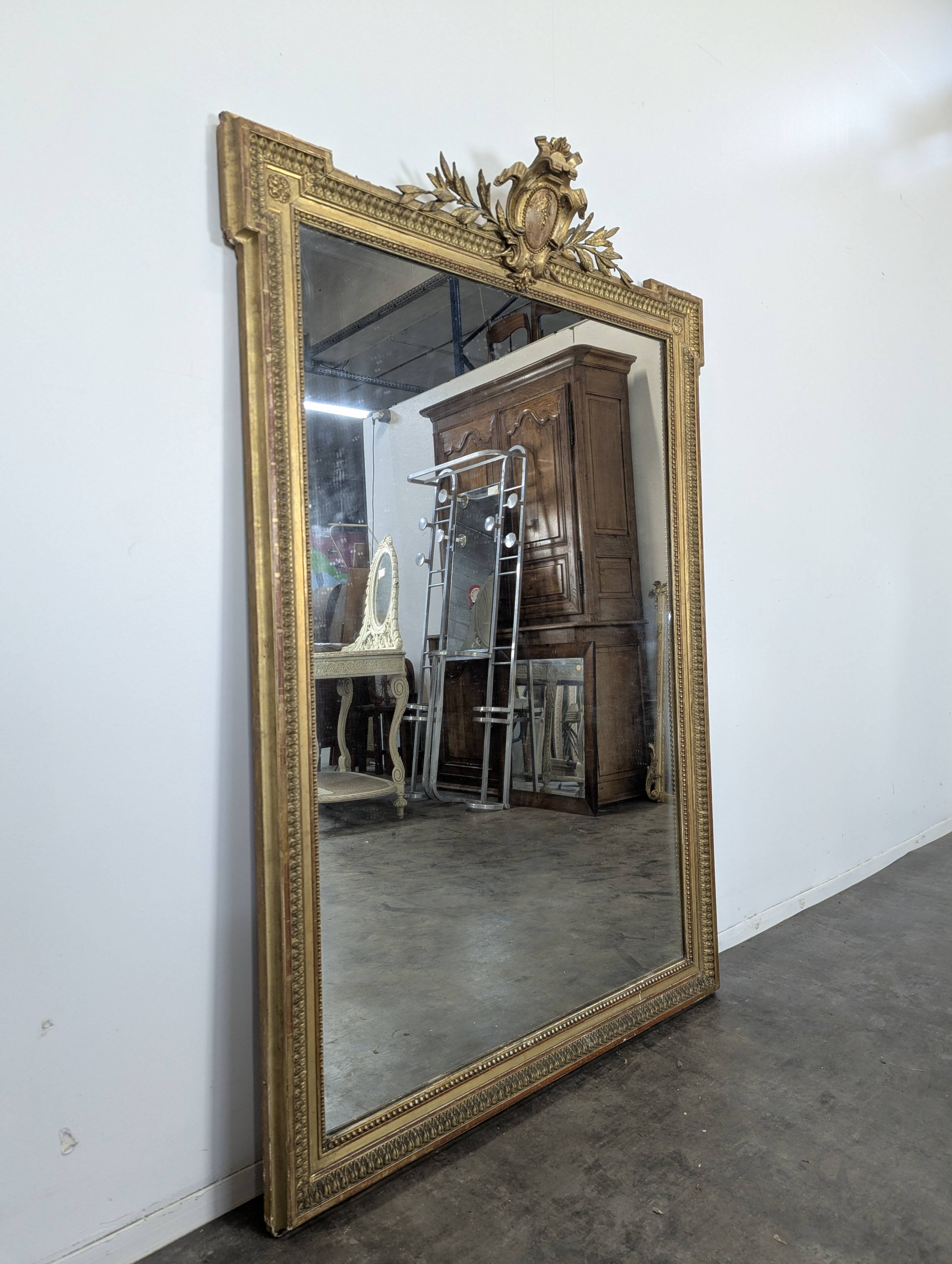 Large stucco and gilded wood mirror from the Napoléon III period.