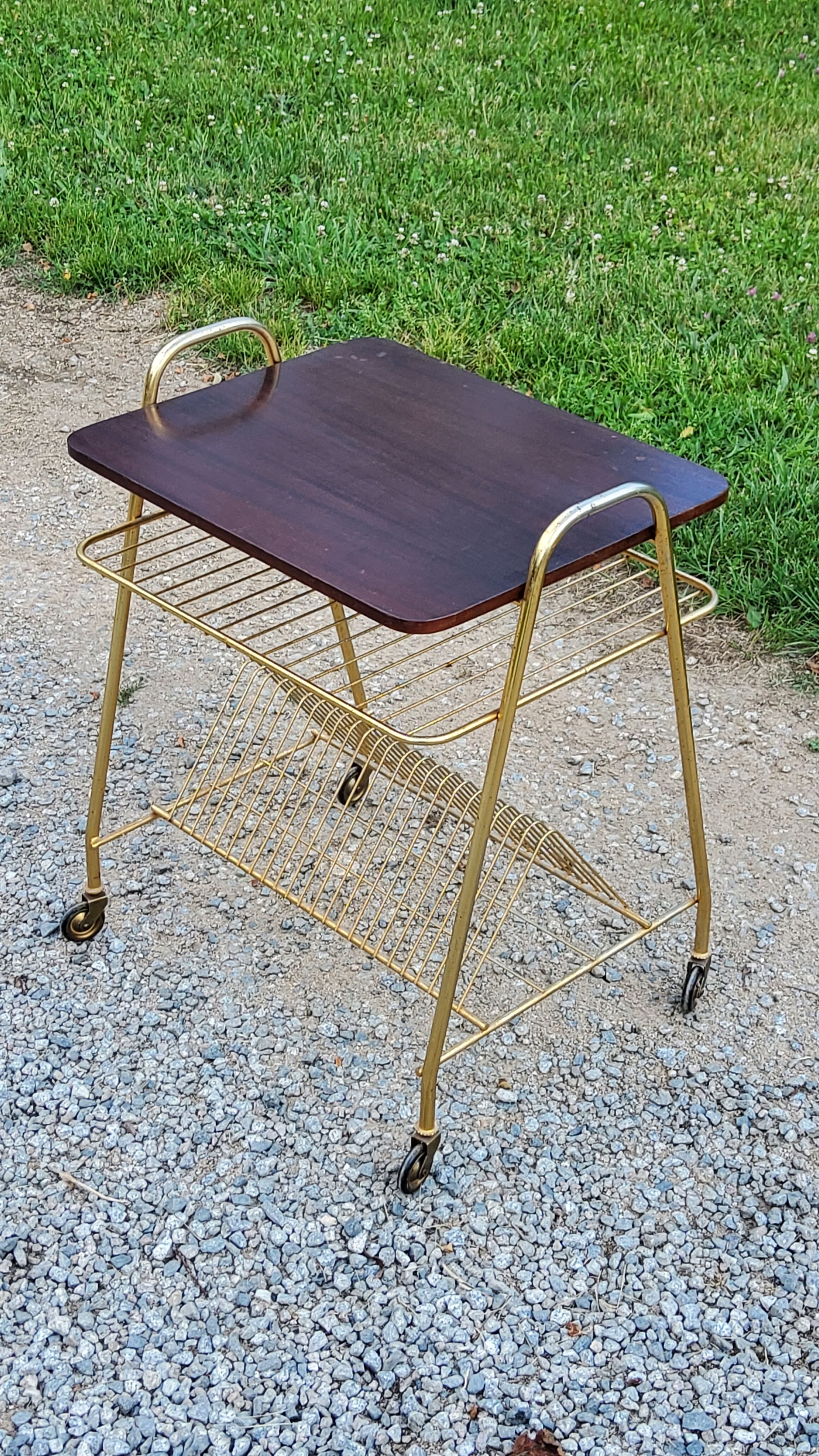 Side table of the 60s mahogany and gold metal range discs