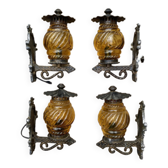 Medieval style metal and amber glass wall lamp