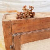 Low cabinet in raw wood and woven raffia