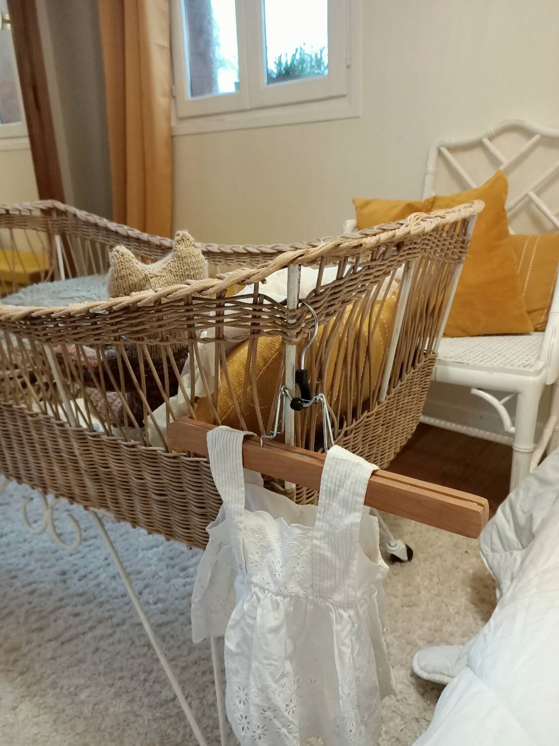 Rattan and wrought iron cradle