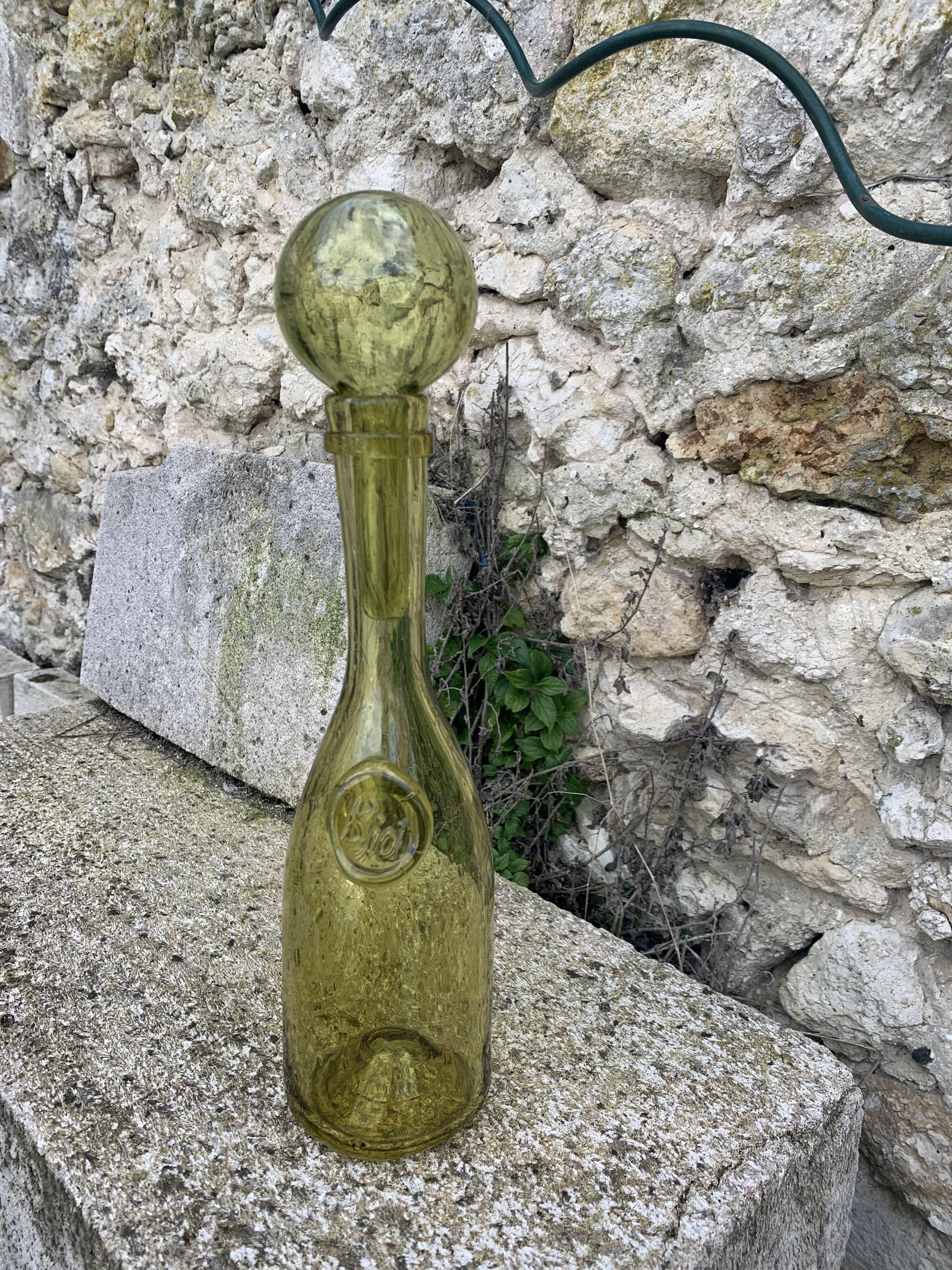 Glassblown glass decanter from the Biot collector glassworks