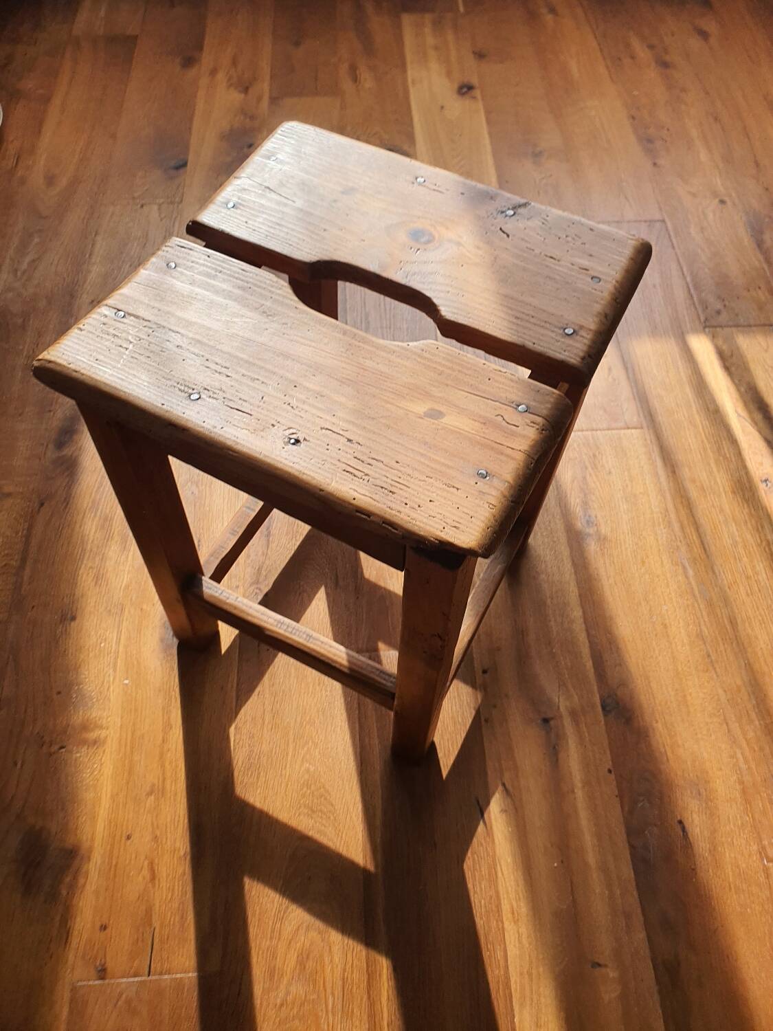 Antique wooden farm stool