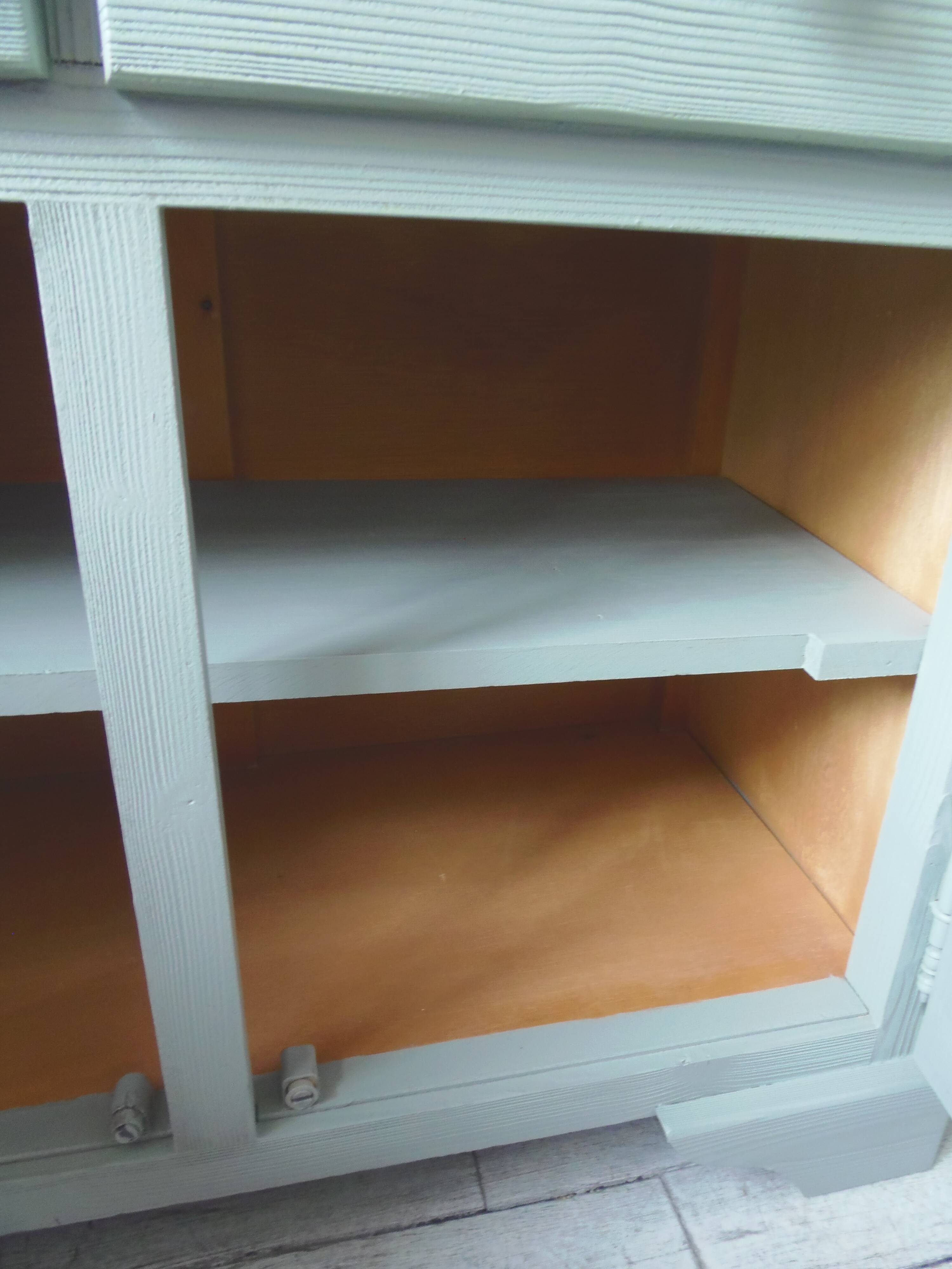 Compact buffet re-enchanted in grey-green, wooden top.