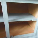 Compact buffet re-enchanted in grey-green, wooden top.