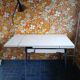 Extendable formica table and vintage 1960s chairs.