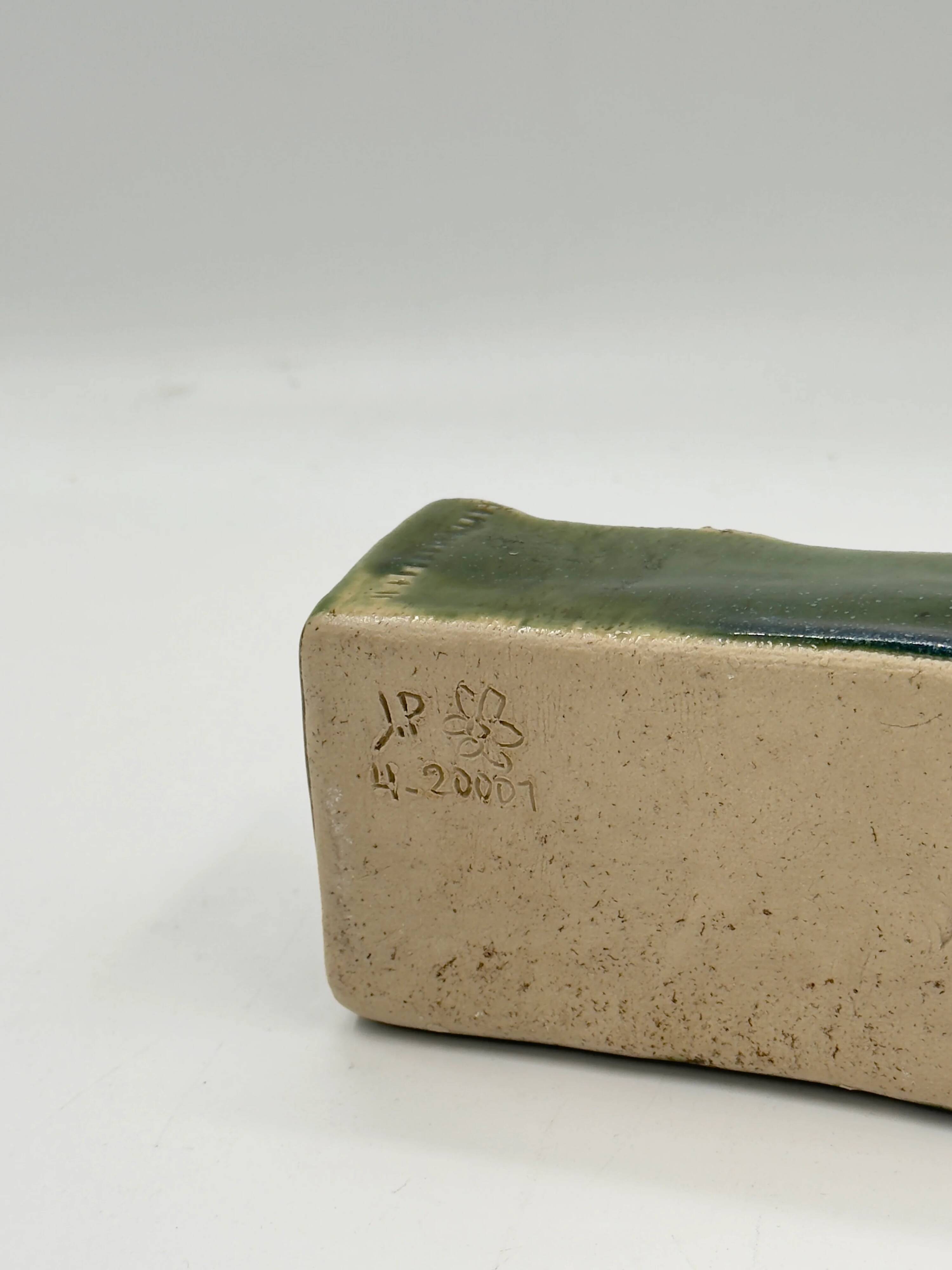 Rectangular ceramic vase signed, woven interior.