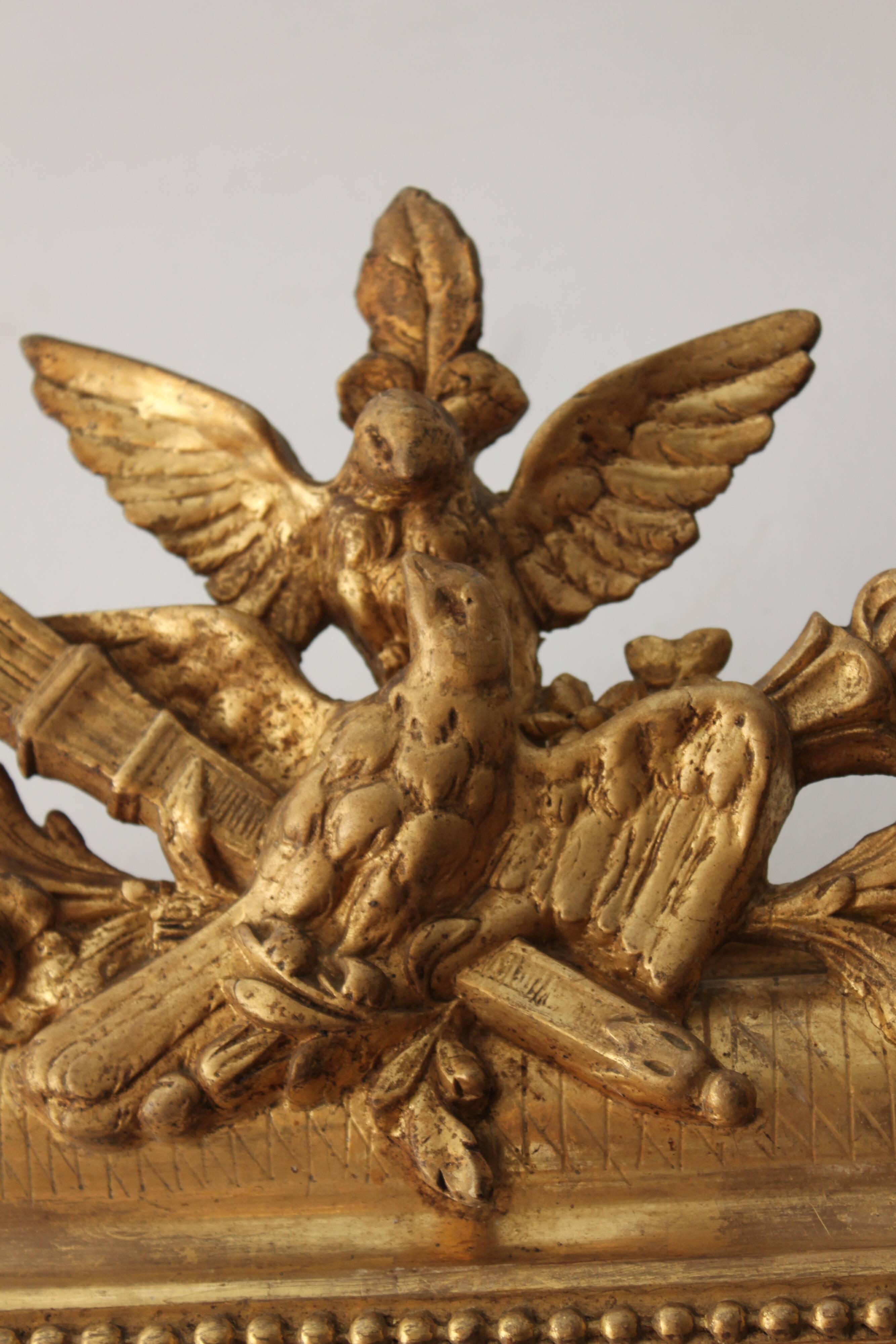 Old gilded mirror with A pediment