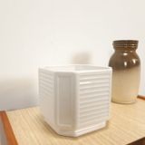 White vintage pot cover with stripes