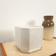 White vintage pot cover with stripes