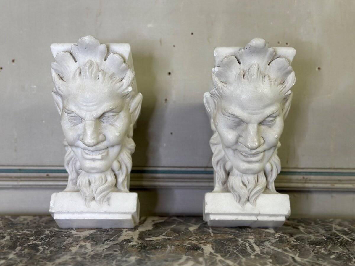 Pair of white statuary marble consoles, with faun heads