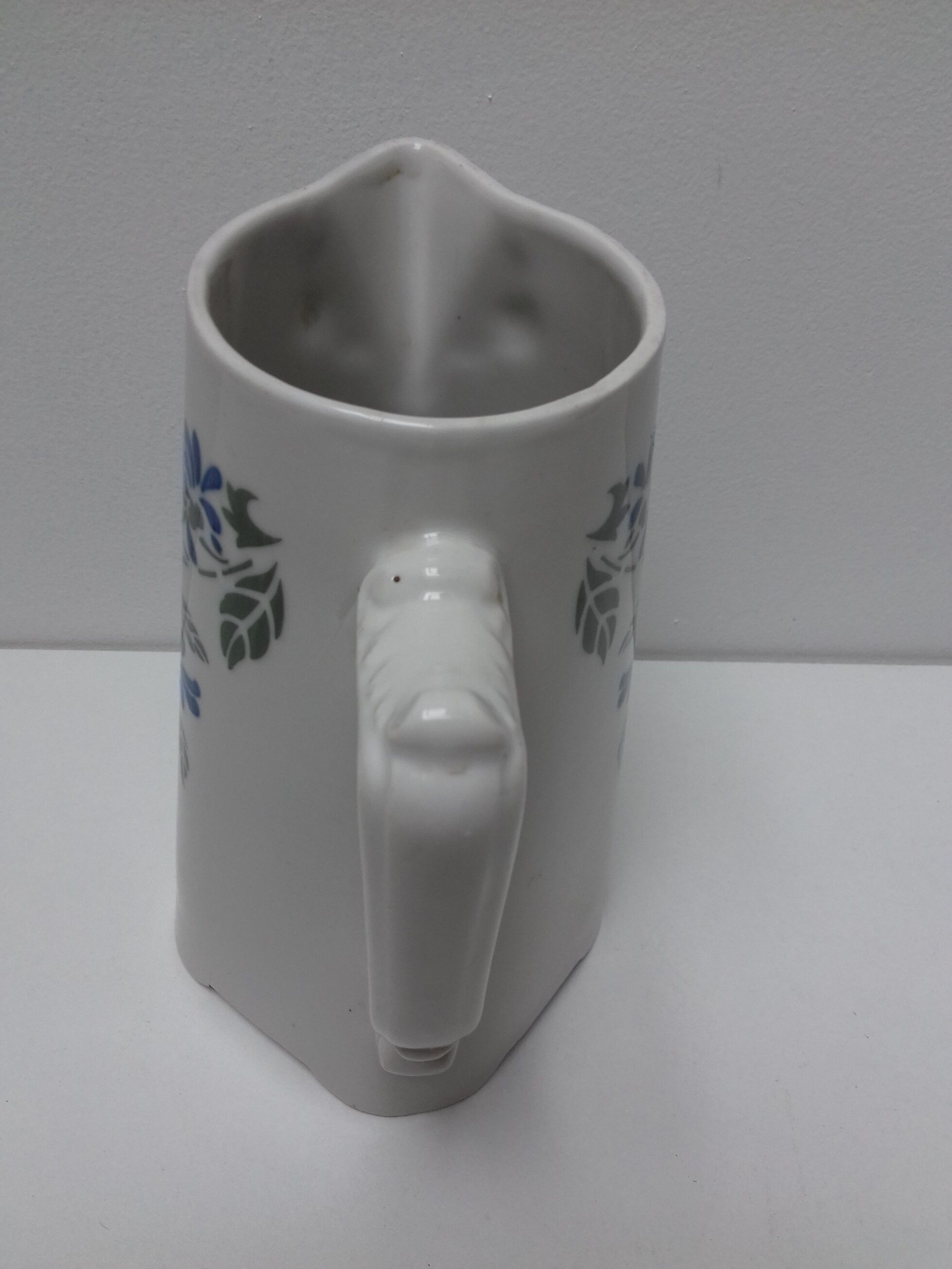 Ancient pitcher ceramic blue flowers