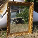 Wooden mirror decorated with gold from the 1920s