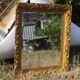Wooden mirror decorated with gold from the 1920s