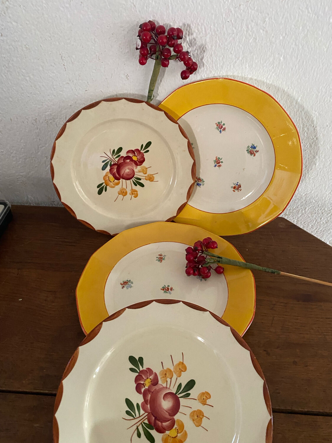 Flowered stamped dessert plates and matching ones.
