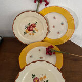 Flowered stamped dessert plates and matching ones.