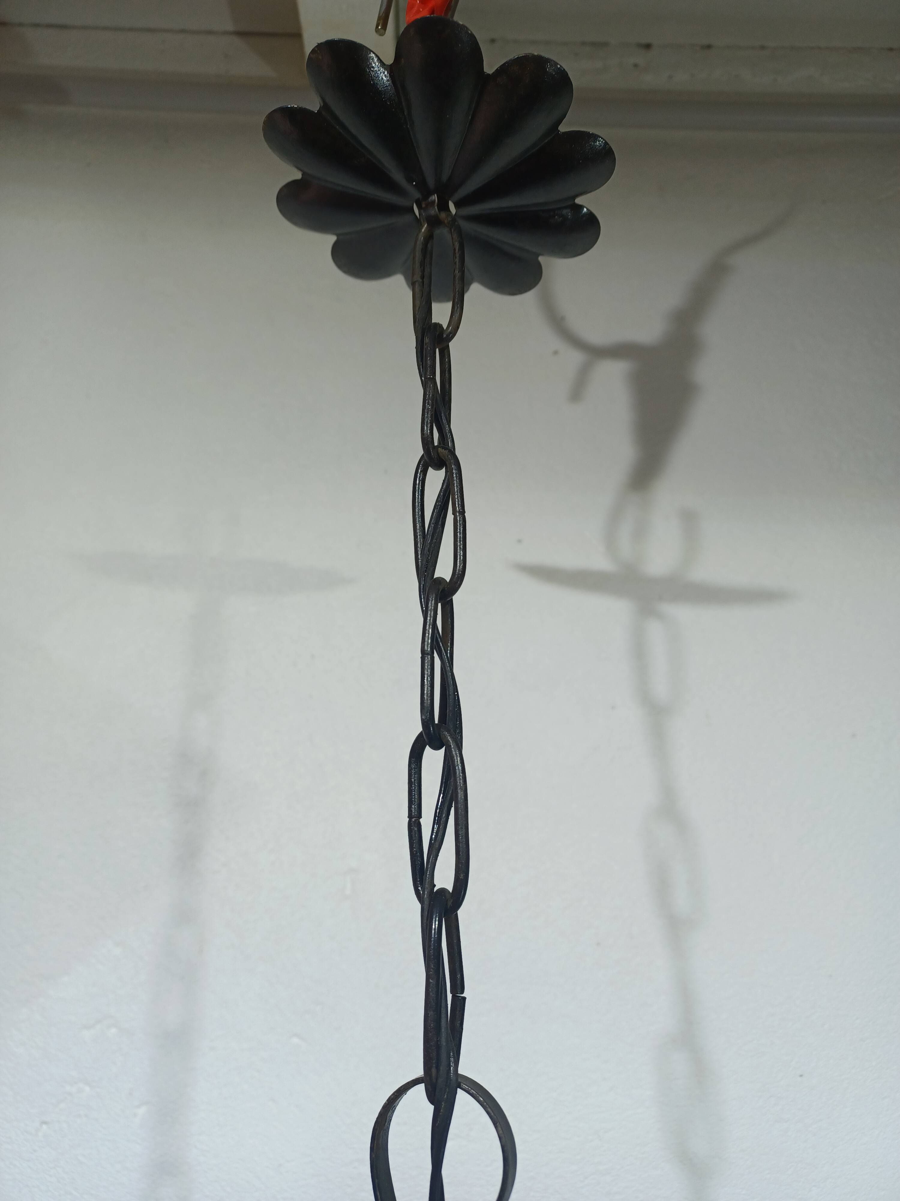 Wrought iron and green glass lantern