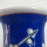 Old blue vase with vintage porcelain cherry blossoms