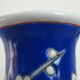 Old blue vase with vintage porcelain cherry blossoms