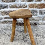 Farm stool in raw wooden sitting in the shape of a popular art