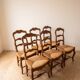 Set of 6 traditional chairs made of solid wood and straw.