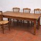 4 rustic farmhouse chairs made of wood and straw