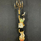 Early XXth era polychrome wooden torch has figuration of a Moor in traditional costume from the 18th