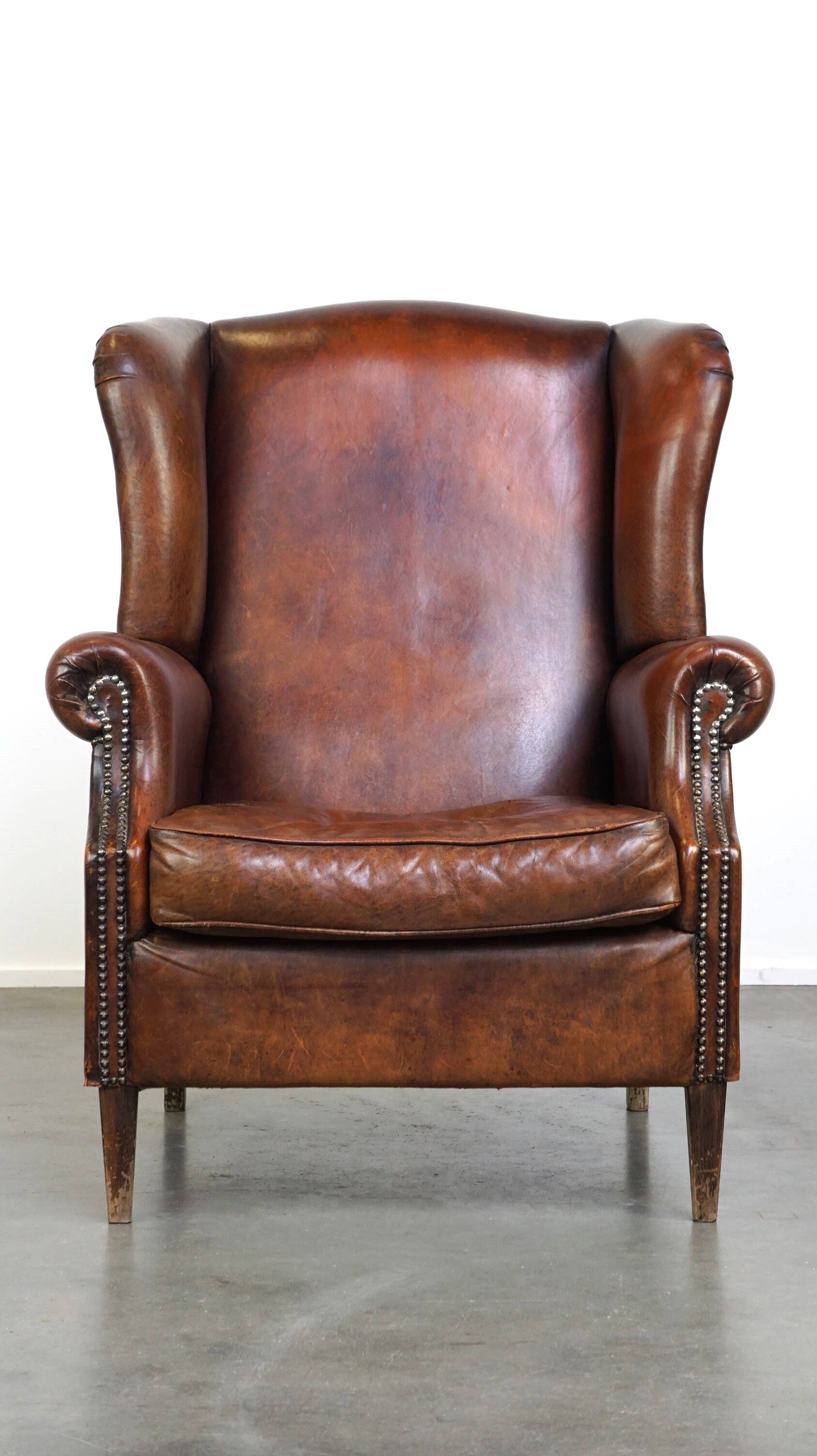 Large sheepskin wing chair with excellent colour and great seating comfort