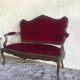Louis XV style sofa trimmed with red velvet
