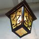 Wrought iron and green glass lantern