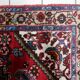 1950s handmade wool medallion rug, red and navy, 96 × 144 cm - 1C1290