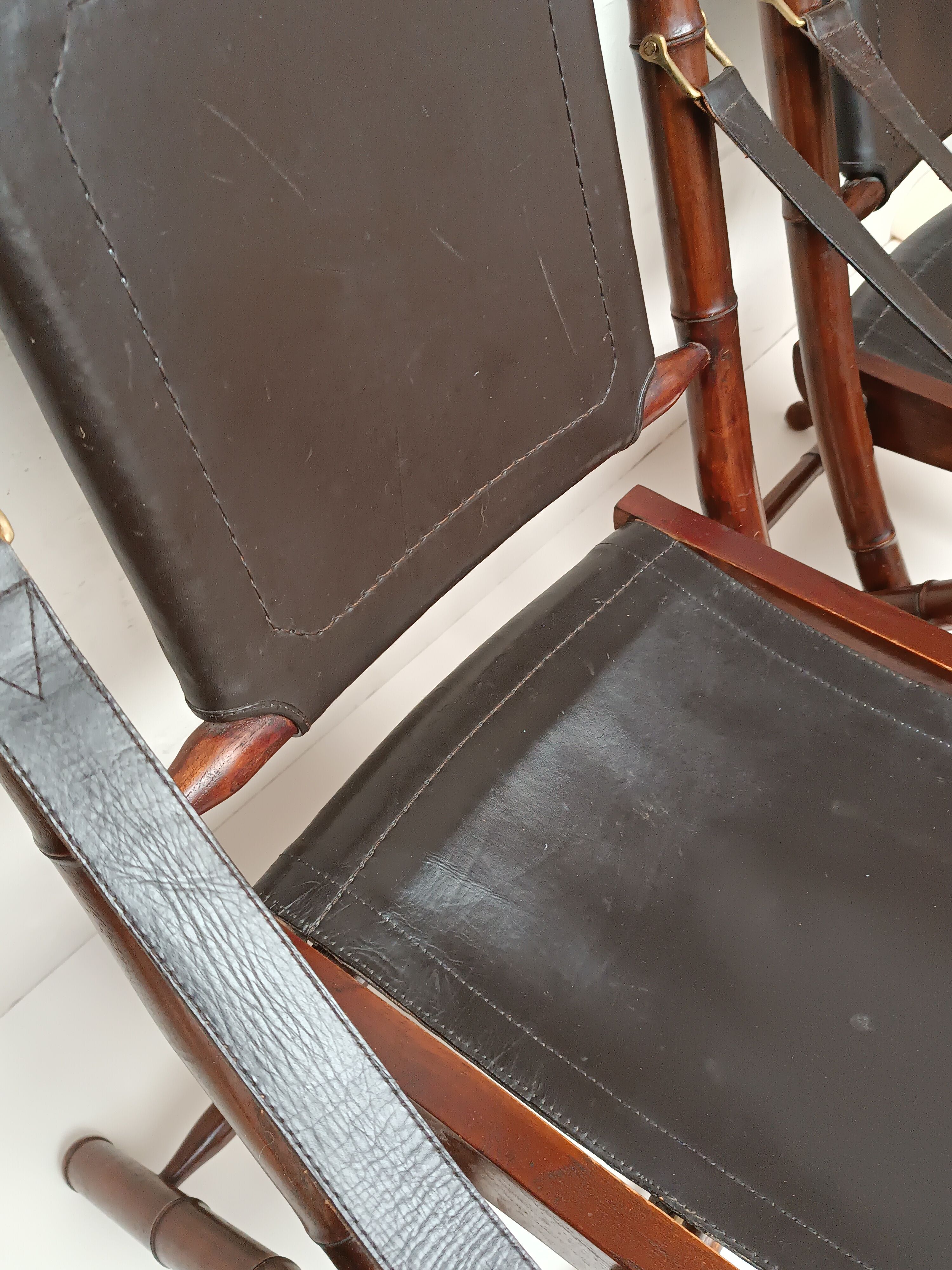 Pair of vintage "safari" folding armchairs in mahogany and leather