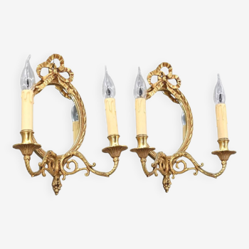 Pair of mirror wall lamps in solid gilded bronze, Louis XVI style with two lights