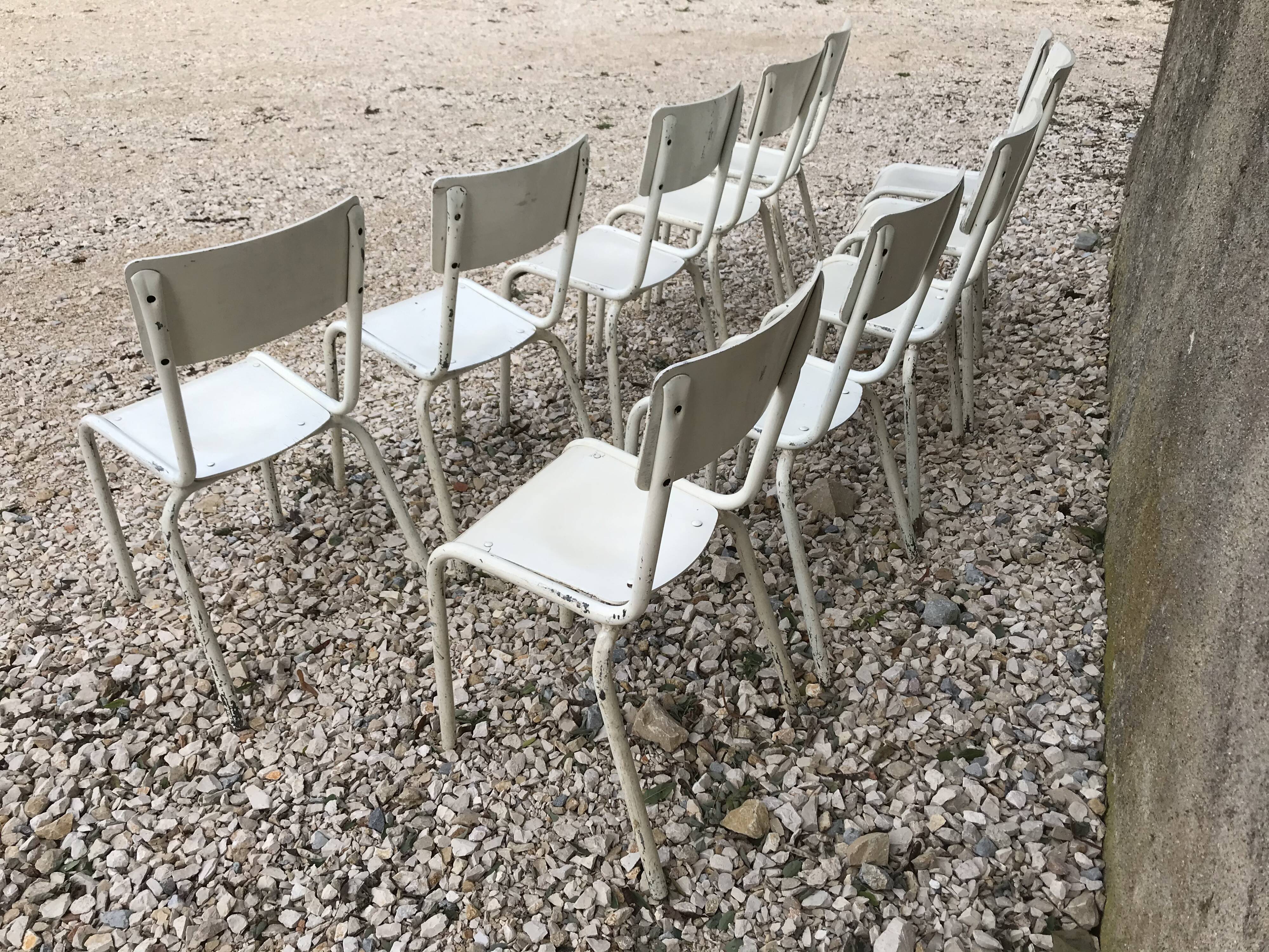 10 white school chairs