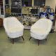 Pair of Mid-Century armchairs in white faux fur with beech legs.