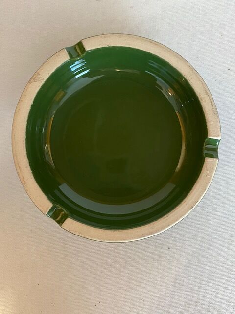 Vintage green ashtray on foot