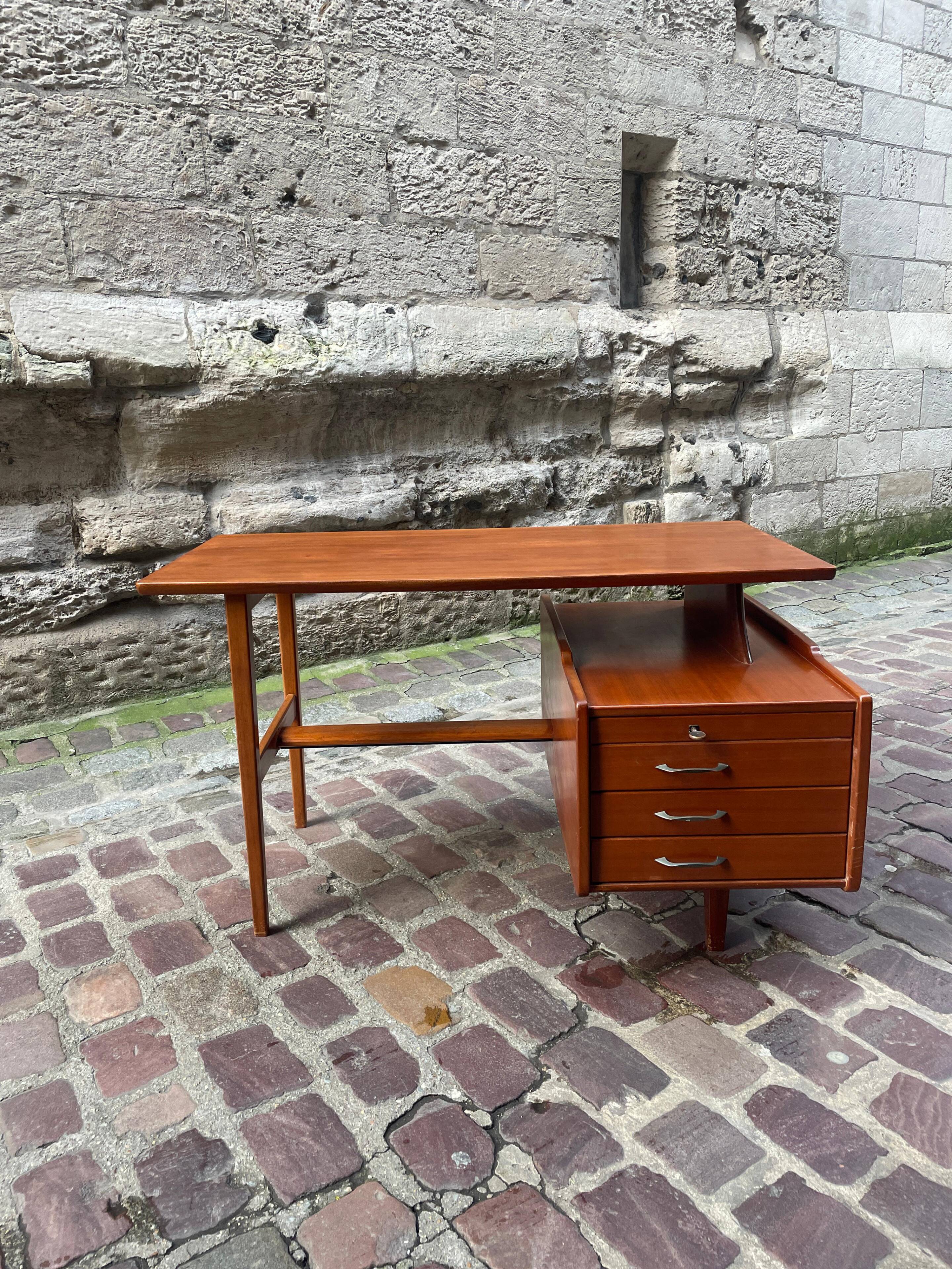 Mahogany desk with drawers by Jacques Hauville published by Bema.
