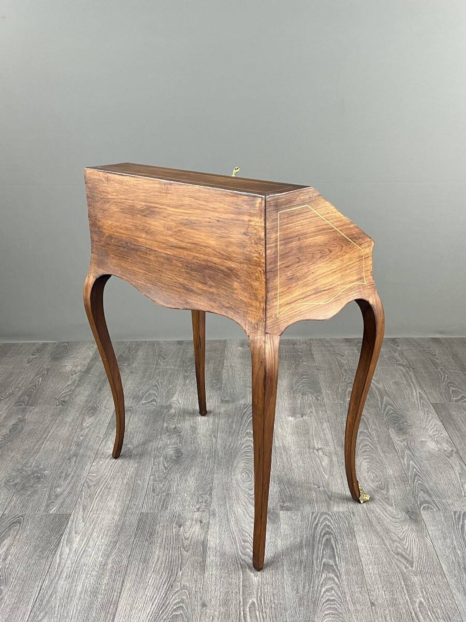 Secretary with a drop-down front in marquetry, Louis XV style, 19th century.