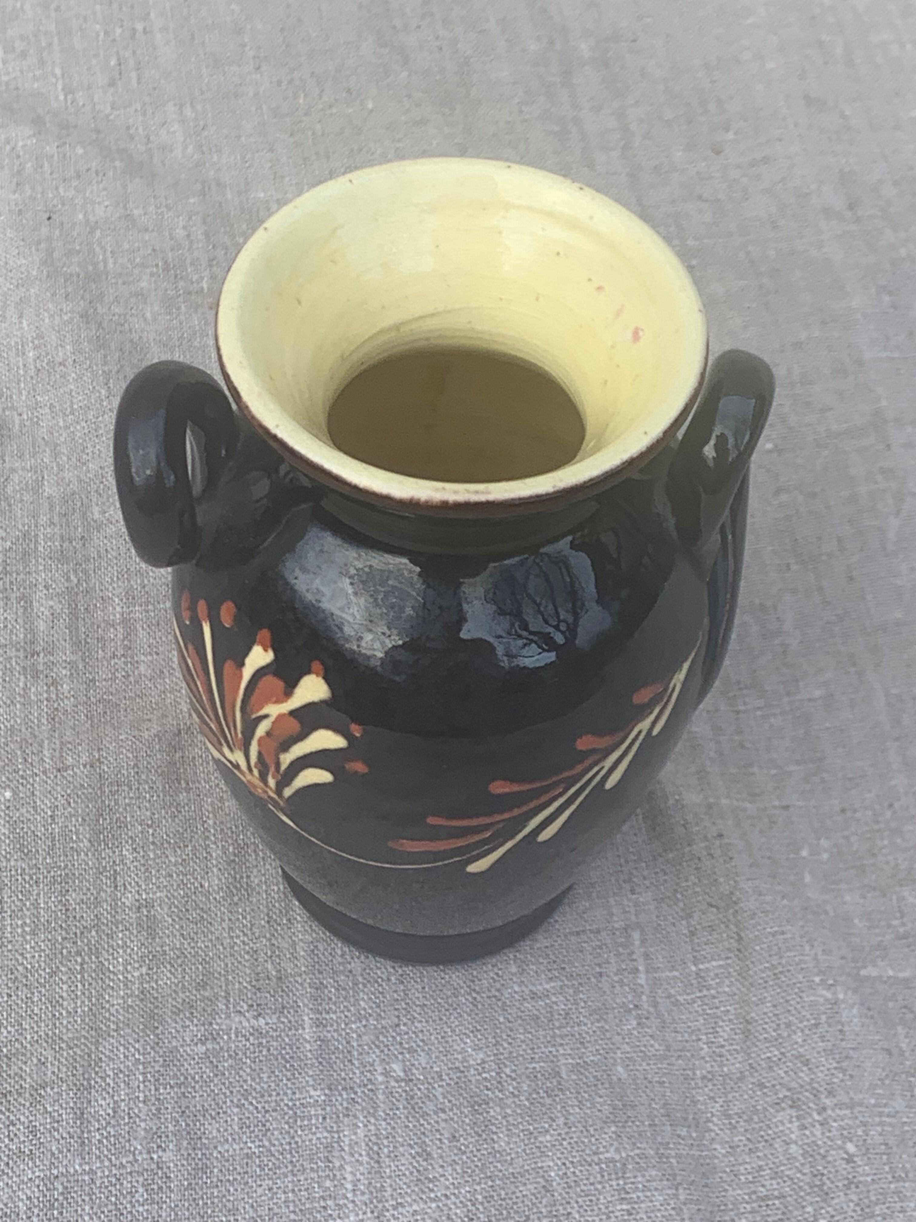 Vintage hand-painted yellow and black glazed ceramic amphora vase