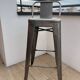 Set of 3 Tolix bar stools in raw (grey) varnished steel