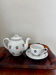 Magnificent teapot and fine porcelain cup set by Pillivuyt with cherries.