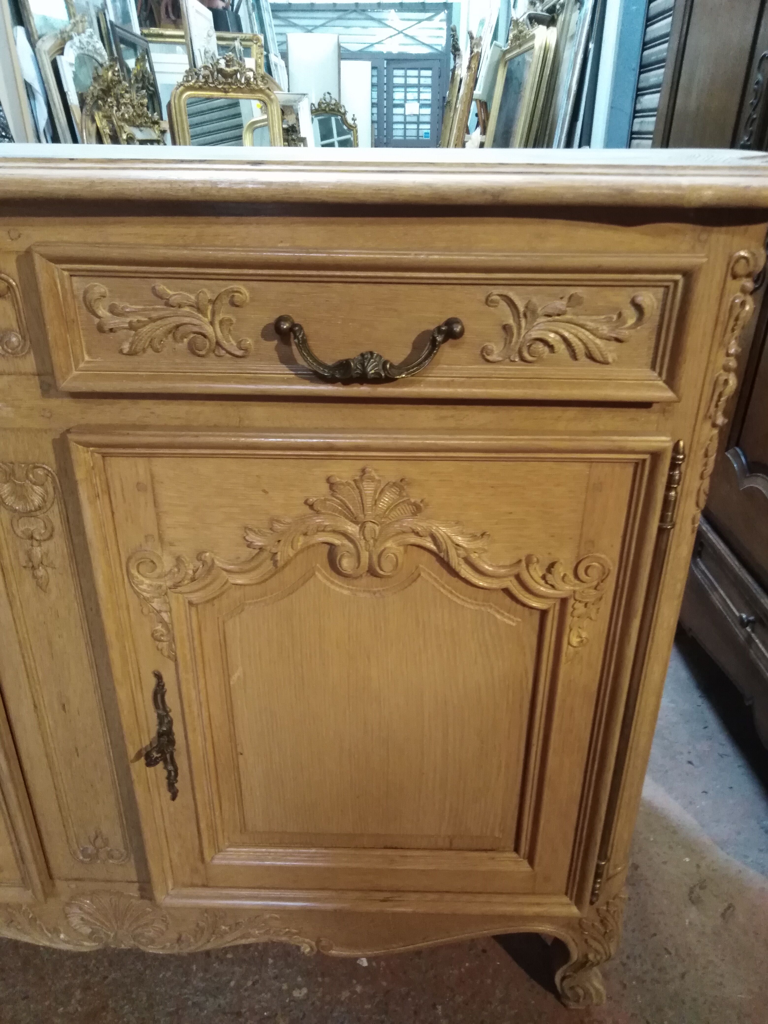 Curved buffet, sculpted Provençal style