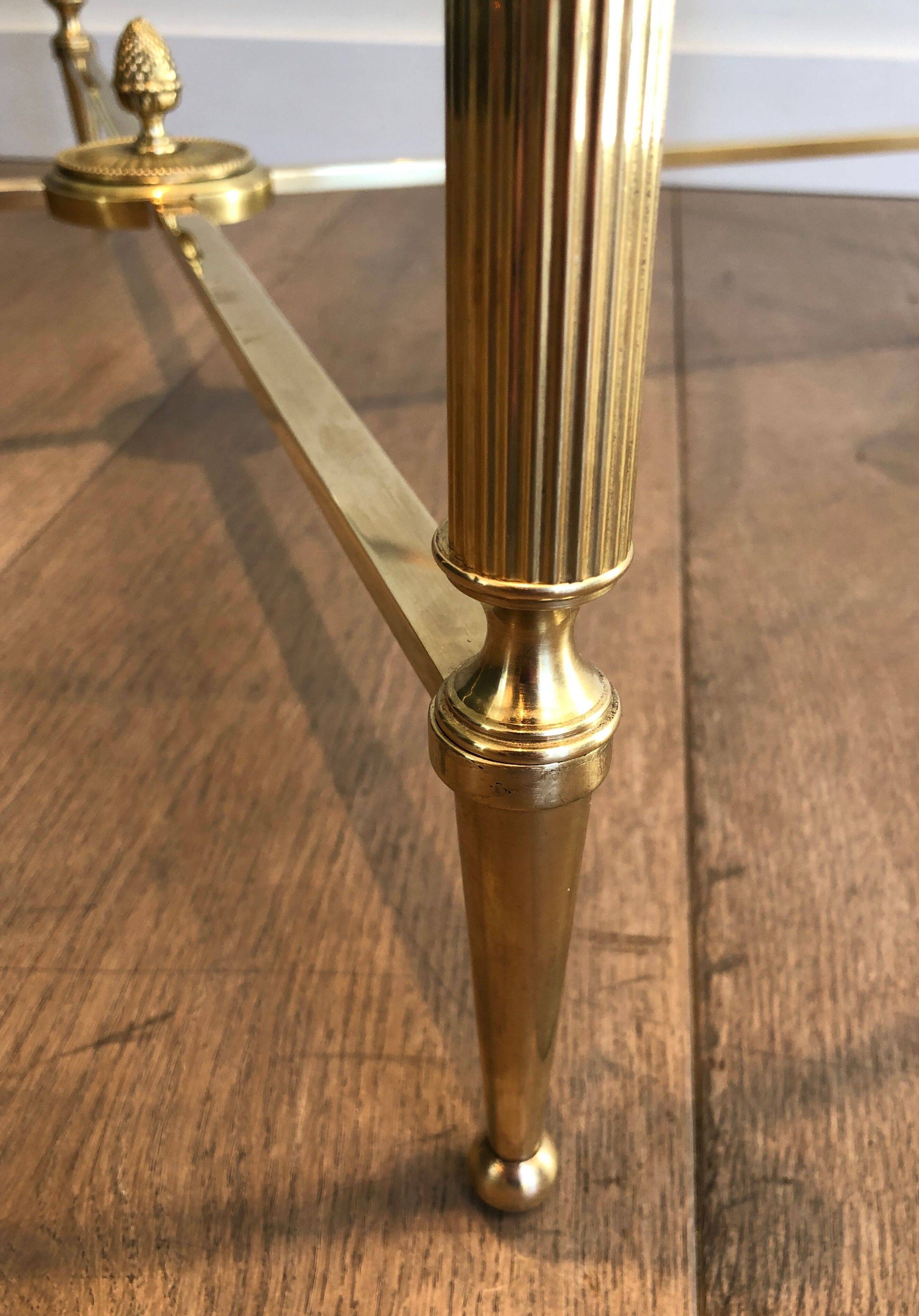 Round brass coffee table. Maison Baguès