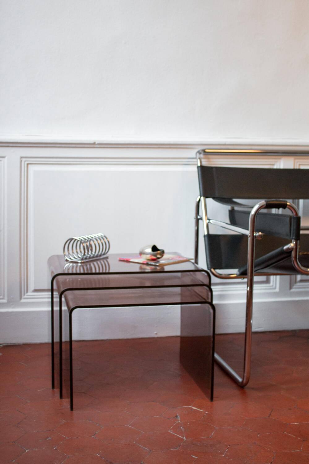 Vintage trio of nesting tables in smoked plexiglass by Michel Dumas, year.