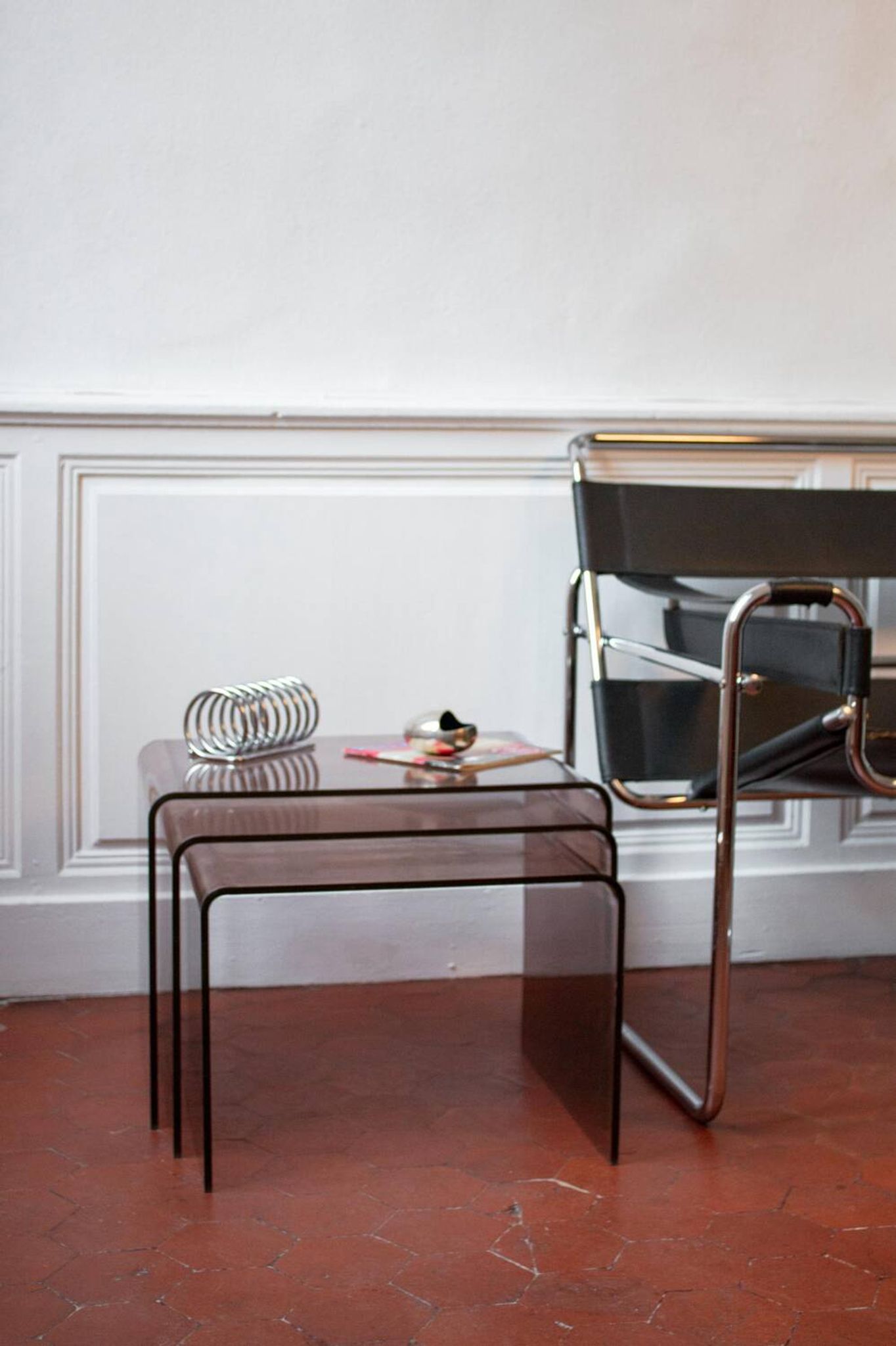 Vintage trio of nesting tables in smoked plexiglass by Michel Dumas, year.
