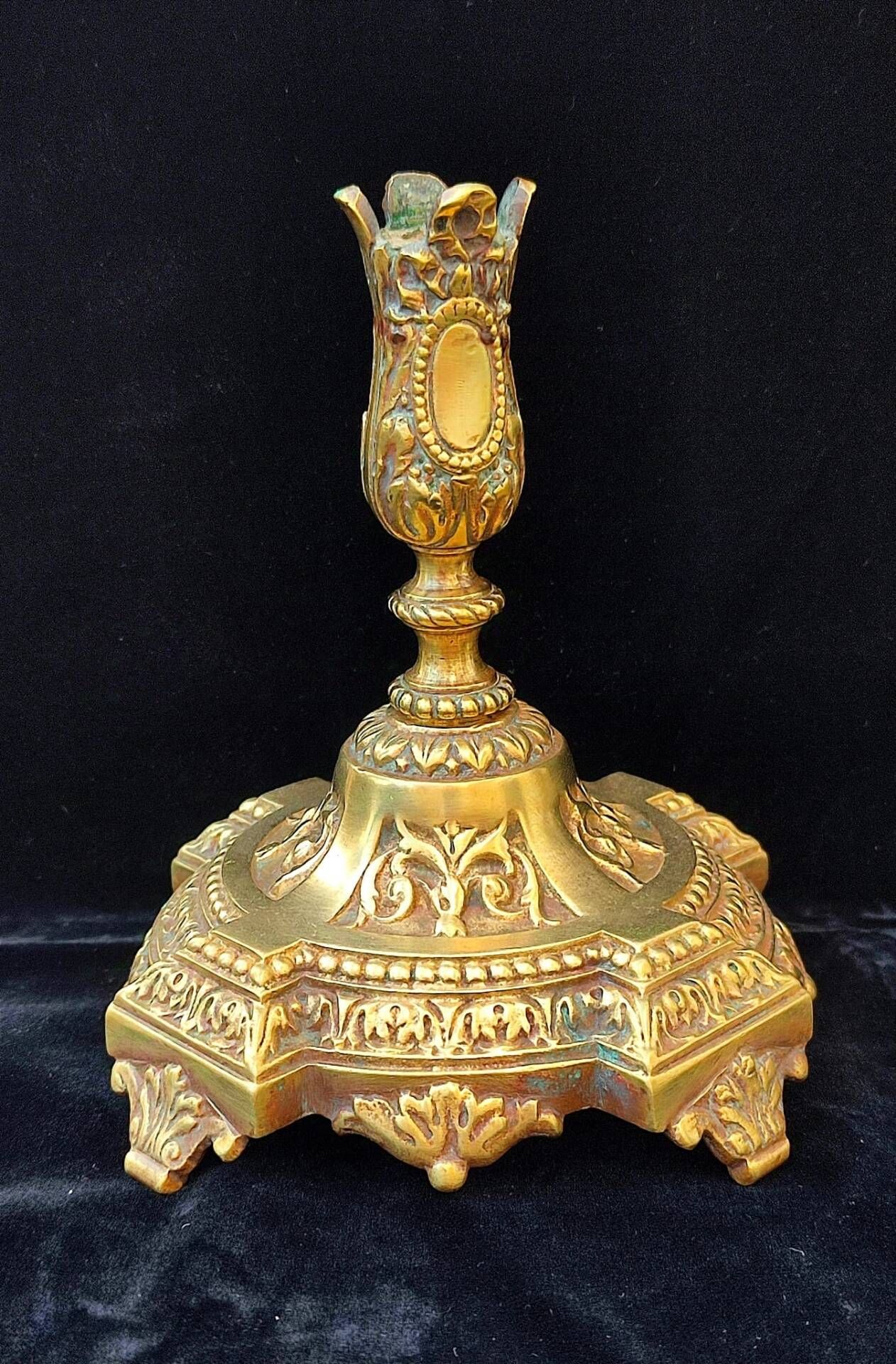 Pair of antique carved bronze candlesticks.